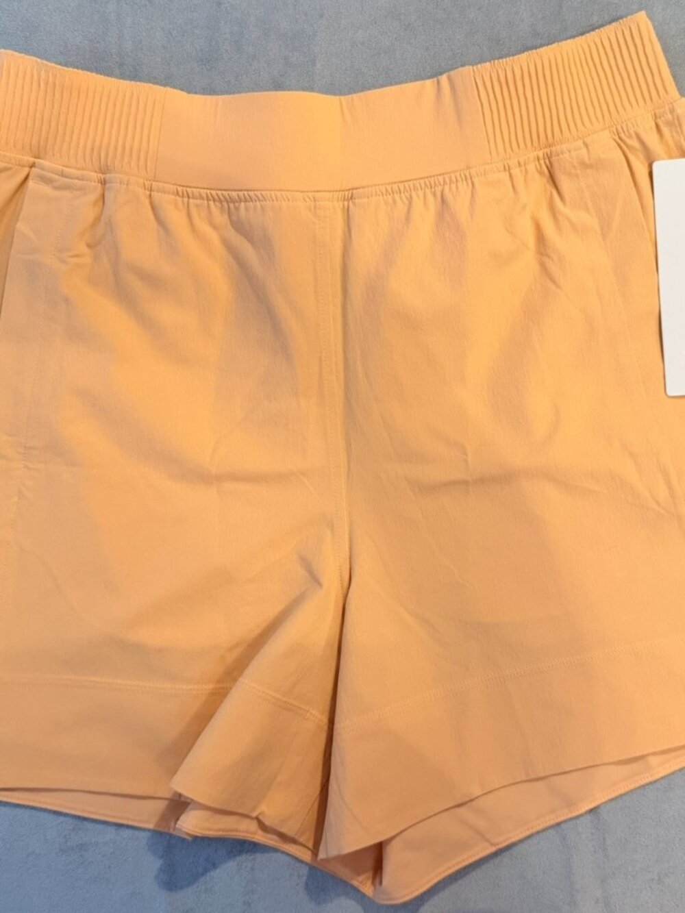 lululemon | Stretch Woven Relaced-Fit HR Short 4" | peach bellini | size large